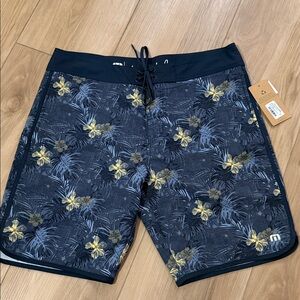 Travis Mathew Navy Floral Swim Board Shorts with Yellow Accents